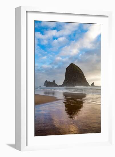 Haystack Rock reflected on the shoreline at Cannon Beach on the Pacific Northwest coast, Oregon, Un-Martin Child-Framed Photographic Print