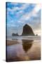 Haystack Rock reflected on the shoreline at Cannon Beach on the Pacific Northwest coast, Oregon, Un-Martin Child-Stretched Canvas