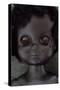 Head and Shoulders of Modern Plastic Black Girl Doll Slightly Scratched and Soiled Lying-Den Reader-Stretched Canvas