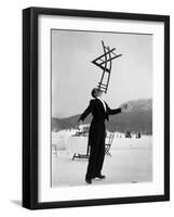 Head Waiter Rene Breguet Balancing Chair on Chin at Ice Rink of Grand Hotel-Alfred Eisenstaedt-Framed Photographic Print