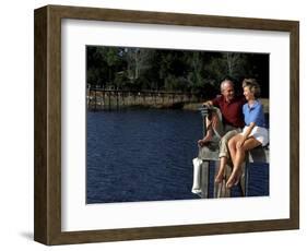 Healthy Couple Sitting on the Dock by a Lake-Bill Bachmann-Framed Photographic Print