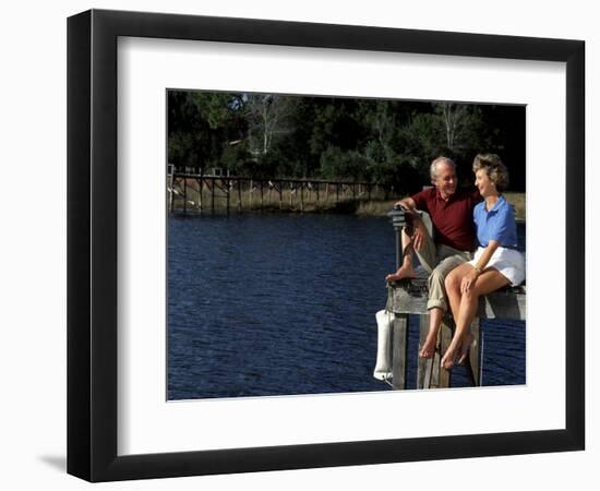 Healthy Couple Sitting on the Dock by a Lake-Bill Bachmann-Framed Photographic Print