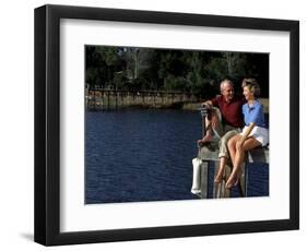 Healthy Couple Sitting on the Dock by a Lake-Bill Bachmann-Framed Photographic Print