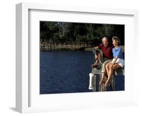 Healthy Couple Sitting on the Dock by a Lake-Bill Bachmann-Framed Photographic Print