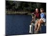 Healthy Couple Sitting on the Dock by a Lake-Bill Bachmann-Mounted Photographic Print