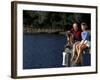 Healthy Couple Sitting on the Dock by a Lake-Bill Bachmann-Framed Photographic Print