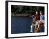 Healthy Couple Sitting on the Dock by a Lake-Bill Bachmann-Framed Photographic Print