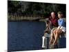 Healthy Couple Sitting on the Dock by a Lake-Bill Bachmann-Mounted Photographic Print