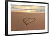 Heart in the Sand on the Beach at Sunset.-Hannamariah-Framed Photographic Print