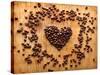 Heart Shape From Brown Coffee Beans, Close-Up On Old Vintage Wooden Background-ouh_desire-Stretched Canvas