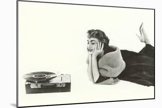 Heavily Browed Lady Listening to Record Player-null-Mounted Art Print