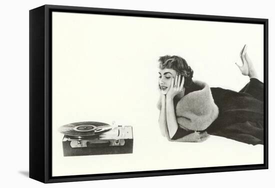 Heavily Browed Lady Listening to Record Player-null-Framed Stretched Canvas