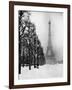 Heavy Snow Blankets the Ground Near the Eiffel Tower-Dmitri Kessel-Framed Photographic Print