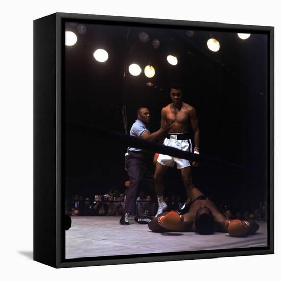 Heavyweight Boxer Cassius Clay, aka Muhammad Ali, Standing over Opponent Sonny Liston-George Silk-Framed Stretched Canvas