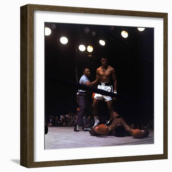 Heavyweight Boxer Cassius Clay, aka Muhammad Ali, Standing over Opponent Sonny Liston-George Silk-Framed Premium Photographic Print