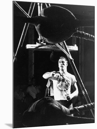 Heavyweight Boxing Contender Jerry Quarry Working Out on Punching Bag, Training at Caesar's Palace-Richard Meek-Mounted Premium Photographic Print