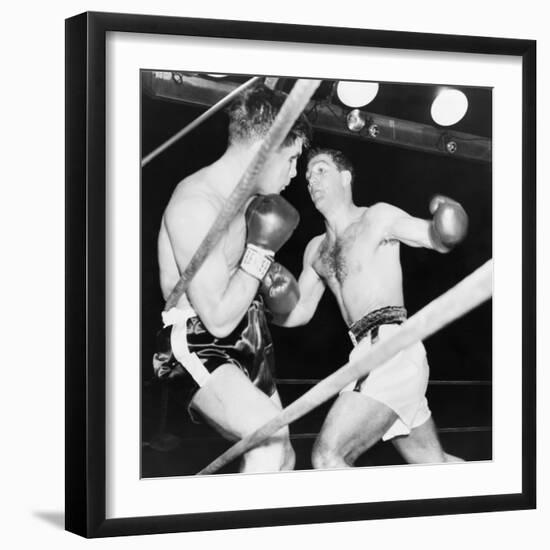 Heavyweight Champion Rocky Marciano (Right) Backs Roland Lastarza Against the Ropes-null-Framed Photo