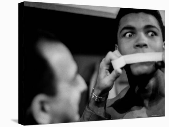 Heavyweight Contender Cassius Clay, Getting His Mouth Taped by Trainer Angelo Dundee-George Silk-Stretched Canvas