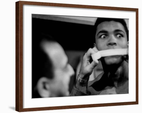 Heavyweight Contender Cassius Clay, Getting His Mouth Taped by Trainer Angelo Dundee-George Silk-Framed Premium Photographic Print