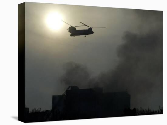 Helicopter Flies Above the Building Where a Plane Crashed in Tehran, Iran-null-Stretched Canvas
