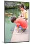 Hello Little Turtle. Young Boy and His Sister Admiring a Young Turtle as it Swims towards Them Look-Juriah-Mounted Photographic Print