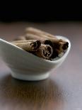 Cinnamon Sticks in Small Bowl-Henrik Freek-Framed Photographic Print