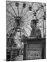 Henry Koerner Standing in Front of Ferris Wheel-null-Mounted Premium Photographic Print
