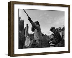 Herbert Lee Pratt Firing His Gun Toward a Grouse While the Loader Reloads Ammunition-John Phillips-Framed Photographic Print