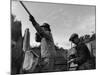 Herbert Lee Pratt Firing His Gun Toward a Grouse While the Loader Reloads Ammunition-John Phillips-Mounted Photographic Print