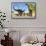 Herd of Apatosaurus Dinosaurs Wander Through a Prehistoric Forest-null-Framed Stretched Canvas displayed on a wall