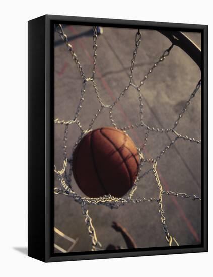 High Angle View of a Basketball in a Net-null-Framed Stretched Canvas