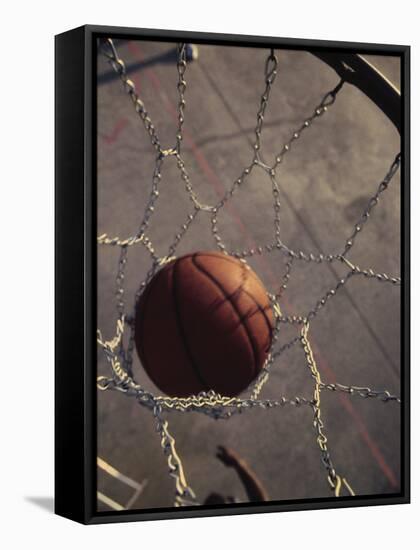 High Angle View of a Basketball in a Net-null-Framed Stretched Canvas