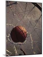 High Angle View of a Basketball in a Net-null-Mounted Photographic Print