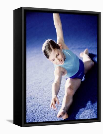 High Angle View of a Female Gymnast Stretching-null-Framed Stretched Canvas