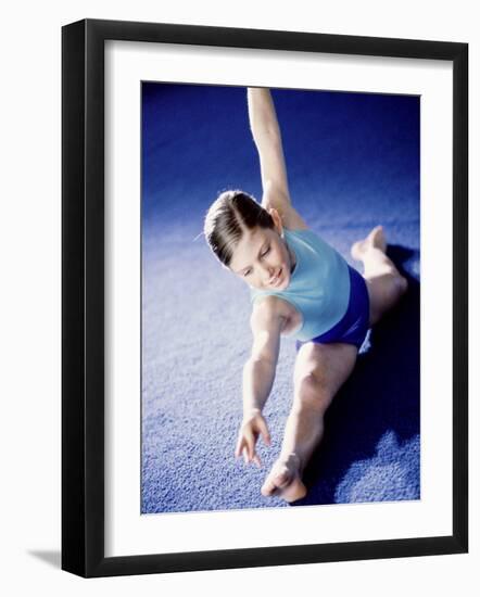 High Angle View of a Female Gymnast Stretching-null-Framed Photographic Print