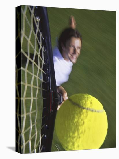 High Angle View of a Man Hitting a Tennis Ball-null-Stretched Canvas