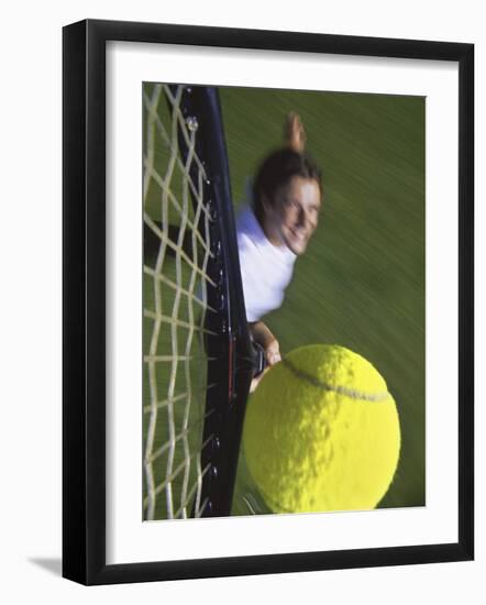 High Angle View of a Man Hitting a Tennis Ball-null-Framed Photographic Print