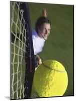 High Angle View of a Man Hitting a Tennis Ball-null-Mounted Photographic Print