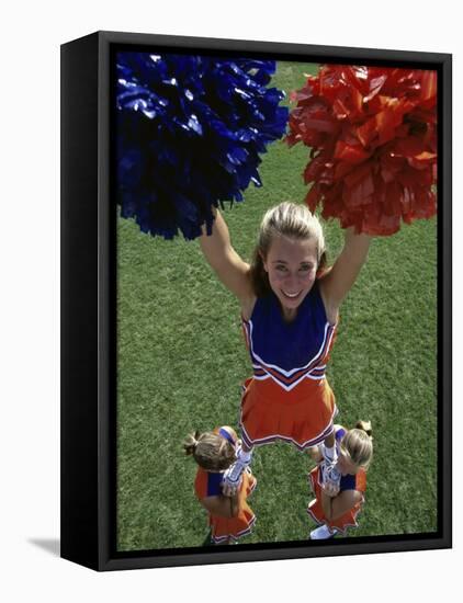 High Angle View of Cheerleaders Performing with Pom-Poms-null-Framed Stretched Canvas