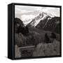 High angle view of road winding up the side of a hill with mountains in the distance-null-Framed Stretched Canvas