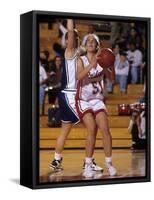 High School Girls Basketball Players in Action During a Game-null-Framed Stretched Canvas