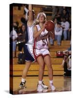 High School Girls Basketball Players in Action During a Game-null-Stretched Canvas