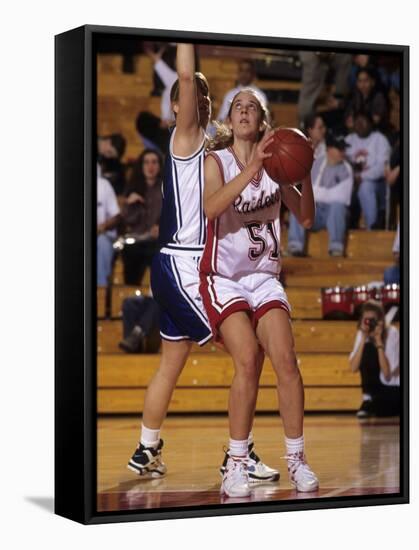 High School Girls Basketball Players in Action During a Game-null-Framed Stretched Canvas