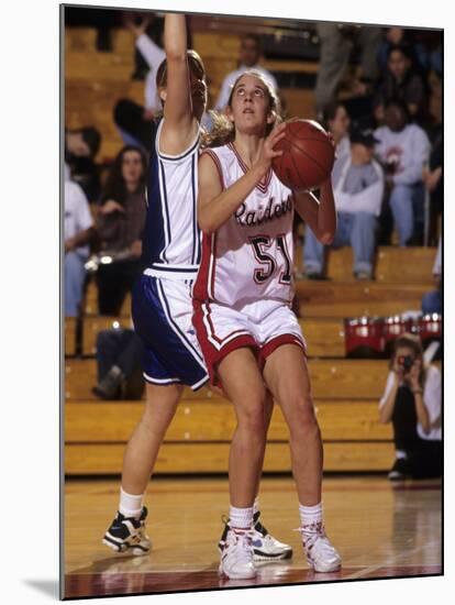 High School Girls Basketball Players in Action During a Game-null-Mounted Photographic Print