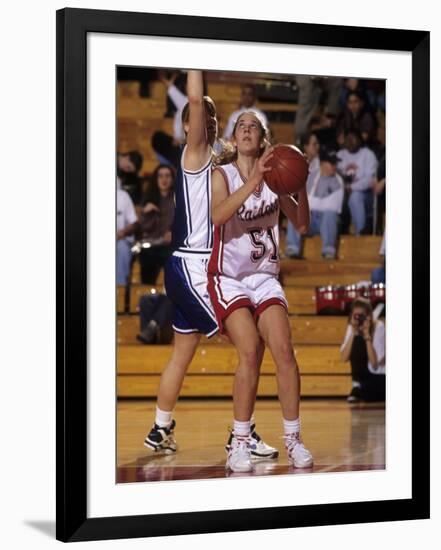 High School Girls Basketball Players in Action During a Game-null-Framed Photographic Print