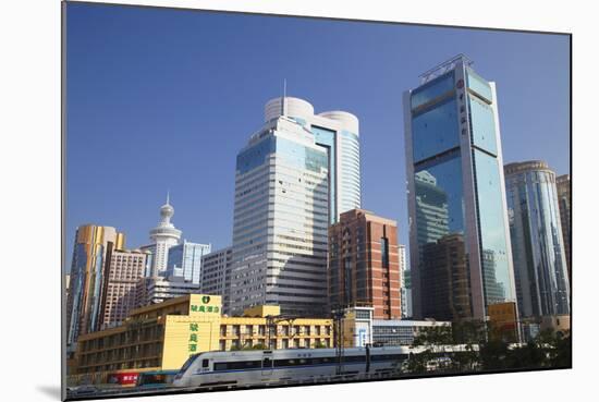 High Speed Train Passing Skyscrapers, Shenzhen, Guangdong, China, Asia-Ian Trower-Mounted Photographic Print