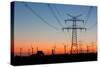 High Voltage Power Lines with Electricity Pylons at Twilight. at the Horizon Wind Turbines and a Nu-Thorsten Schier-Stretched Canvas