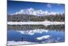 Hiker Admires the Snowy Peaks and Woods Reflected in Lake Palu, Malenco Valley, Valtellina, Italy-Roberto Moiola-Mounted Photographic Print