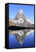 Hiker Admiring the Matterhorn Reflected in Lake Stellisee, Swiss Alps-Roberto Moiola-Framed Stretched Canvas