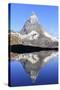 Hiker Admiring the Matterhorn Reflected in Lake Stellisee, Swiss Alps-Roberto Moiola-Stretched Canvas